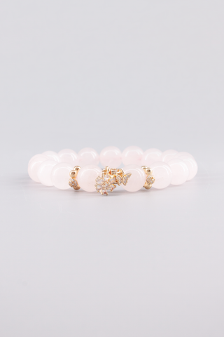 Rosenquarz Armband 10 mm – Seitenansicht des handgefertigten Schmuckstücks, Starlight Kollektion von Gembonbon